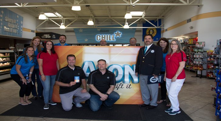 Alon Brands Inc. team members join representatives from Guinness World Records as the retailer sets the record for the World's Largest Gift Card.