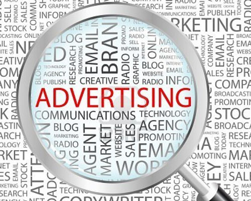 magnifying glass over word advertising