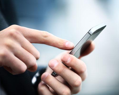 Consumer typing on mobile phone