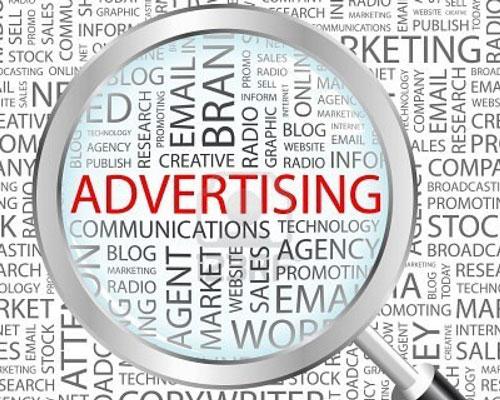 magnifying glass over word advertising