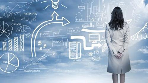 a generic image of a women looking at a work board