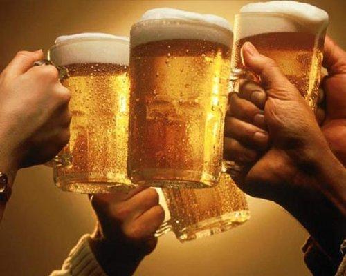 Friends toasting with beer mugs
