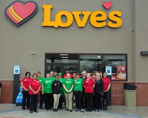 Team members prepare to greet customers at the new Love's Country Store in Wynnewood, Okla. on March 1.