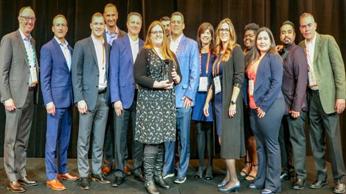 InComm team members accept the 7-Eleven Vendor Partner of the Year award.