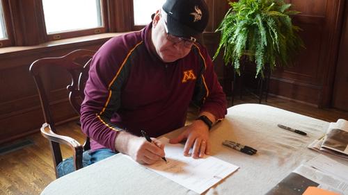 Gov. Tim Walz signs several bills into law on May 16, including the state's new Tobacco 21 rule.