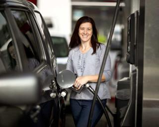 woman pumping gas