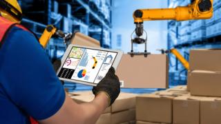 An employee working in a supply warehouse