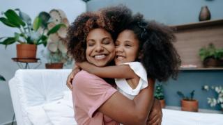 Mom and daughter hugging