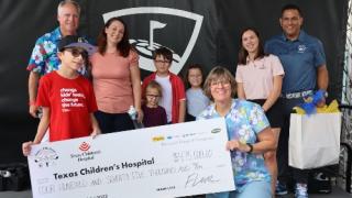 Loves donation check to CMN