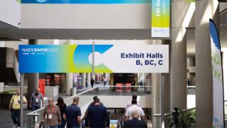 Attendees going to the 2023 NACS Show expo floor