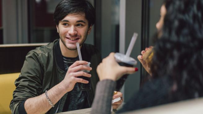 Gen Z couple eating at a restaurant