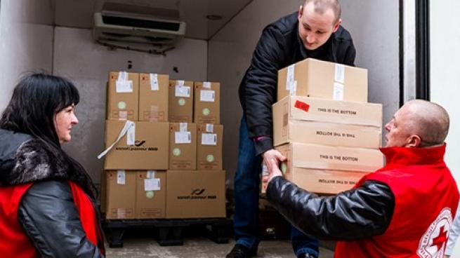 Red Cross volunteers unload donations