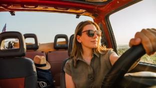 Woman driving a car during the summer