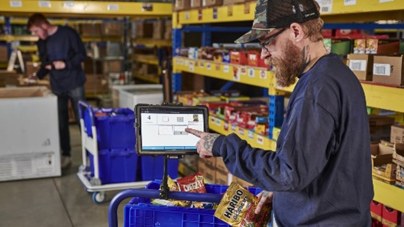 Warehouse worker using Cantaloupe Seed Pick-Easy software