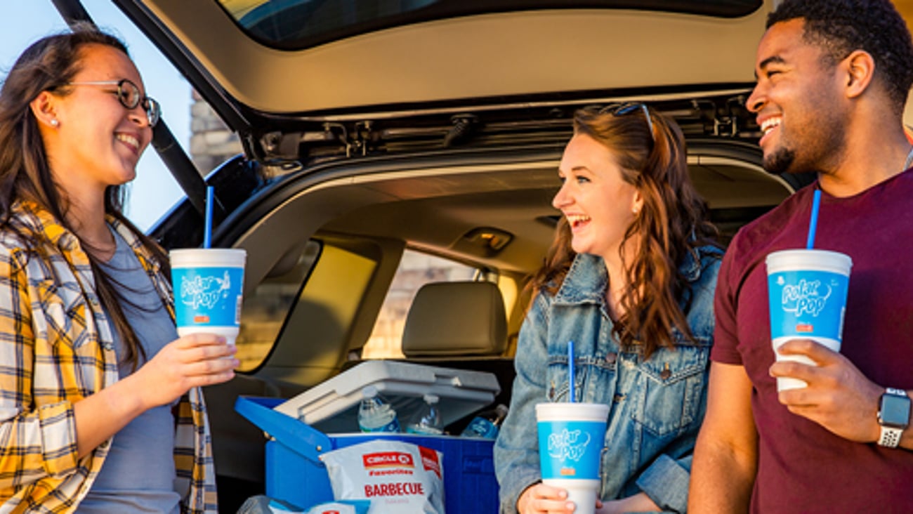 Three friends enjoying Circle K Polar Pop and snacks