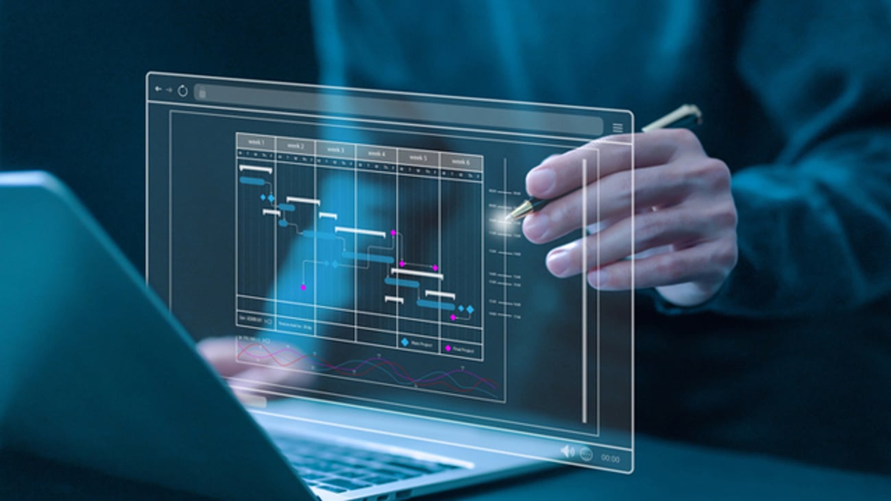 A person using a computer AI program to make a work schedule