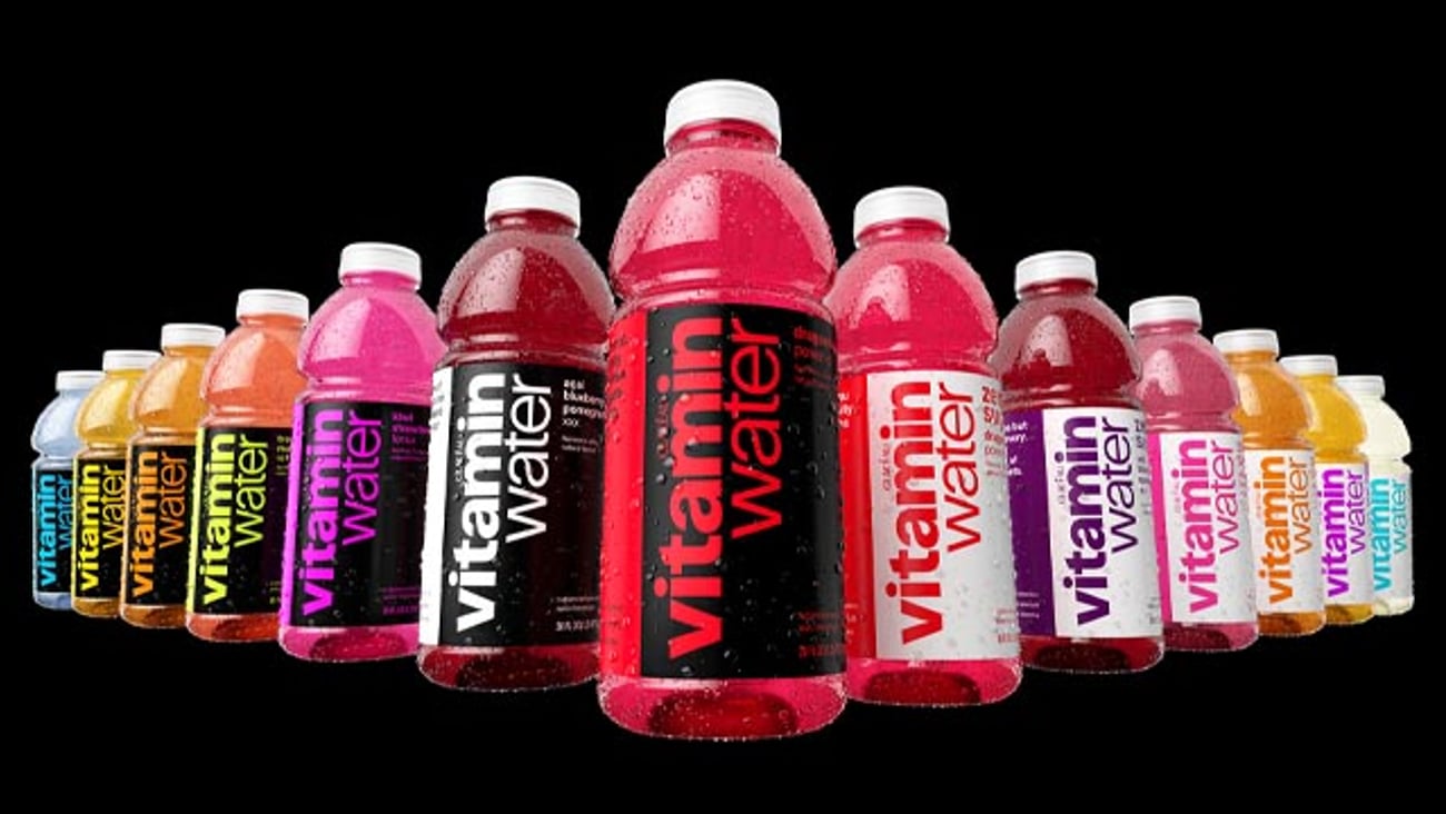 Several bottles of vitaminwater with the new look