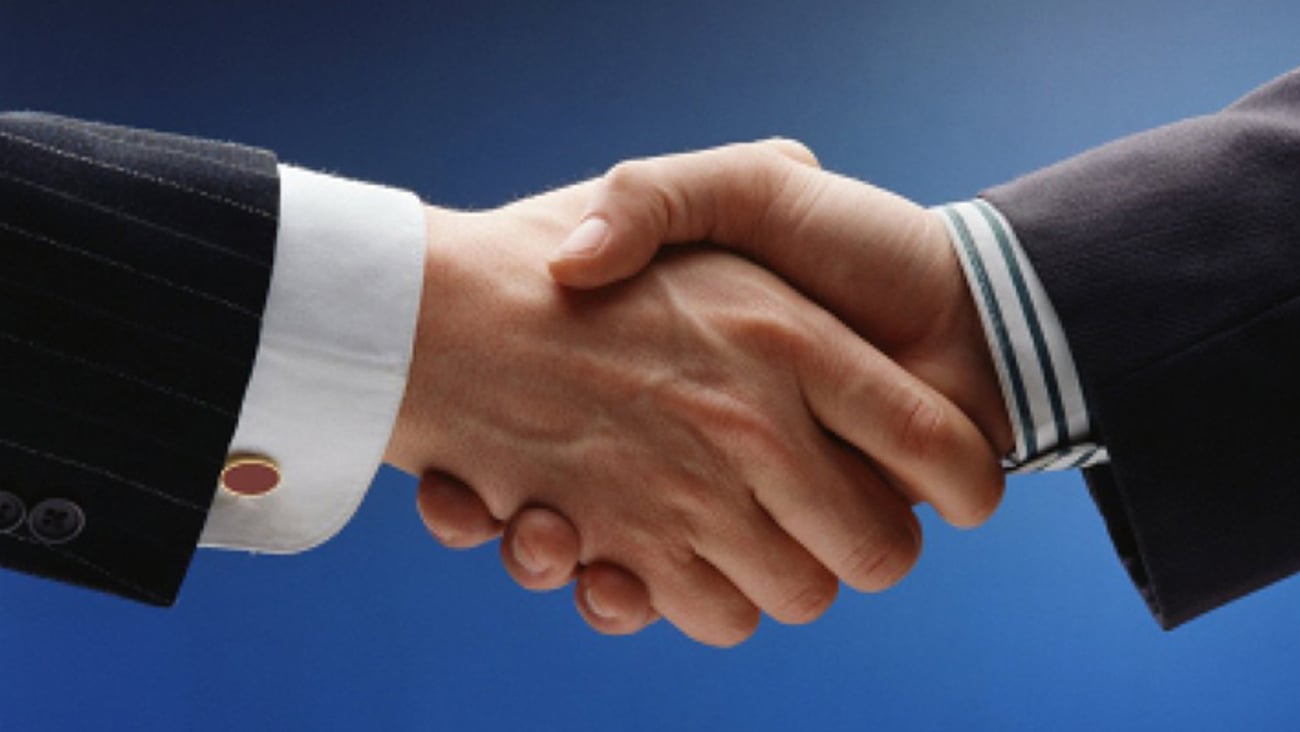 A handshake between two men in business suits