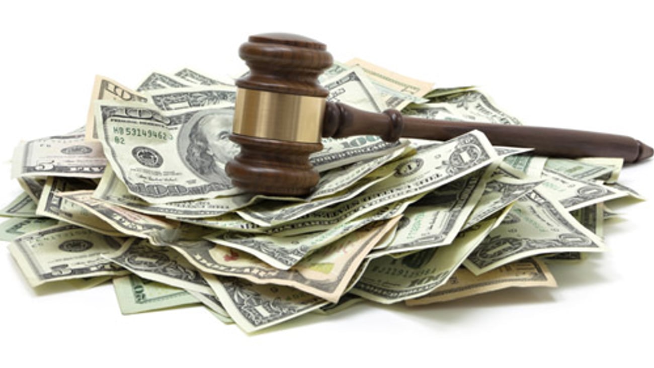 A gavel on top of money