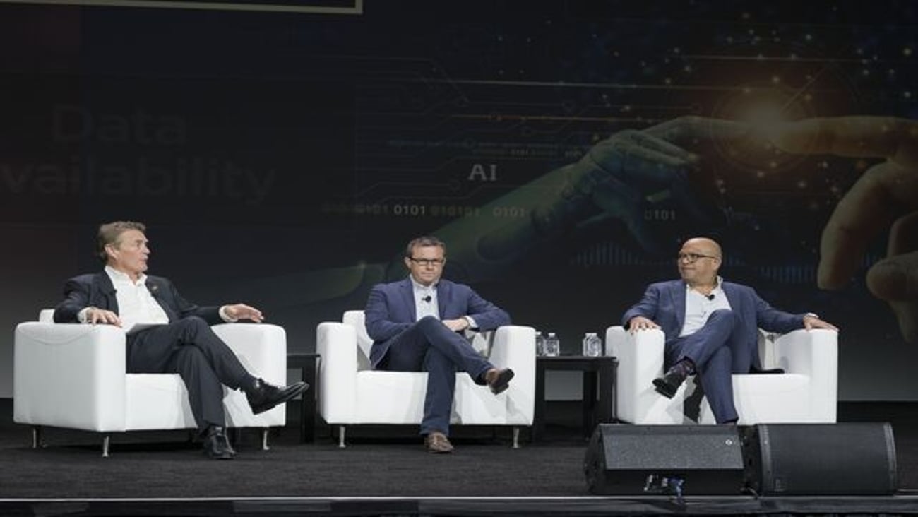 Panelists talk about artificial intelligence on stage at the 2024 NACS Show