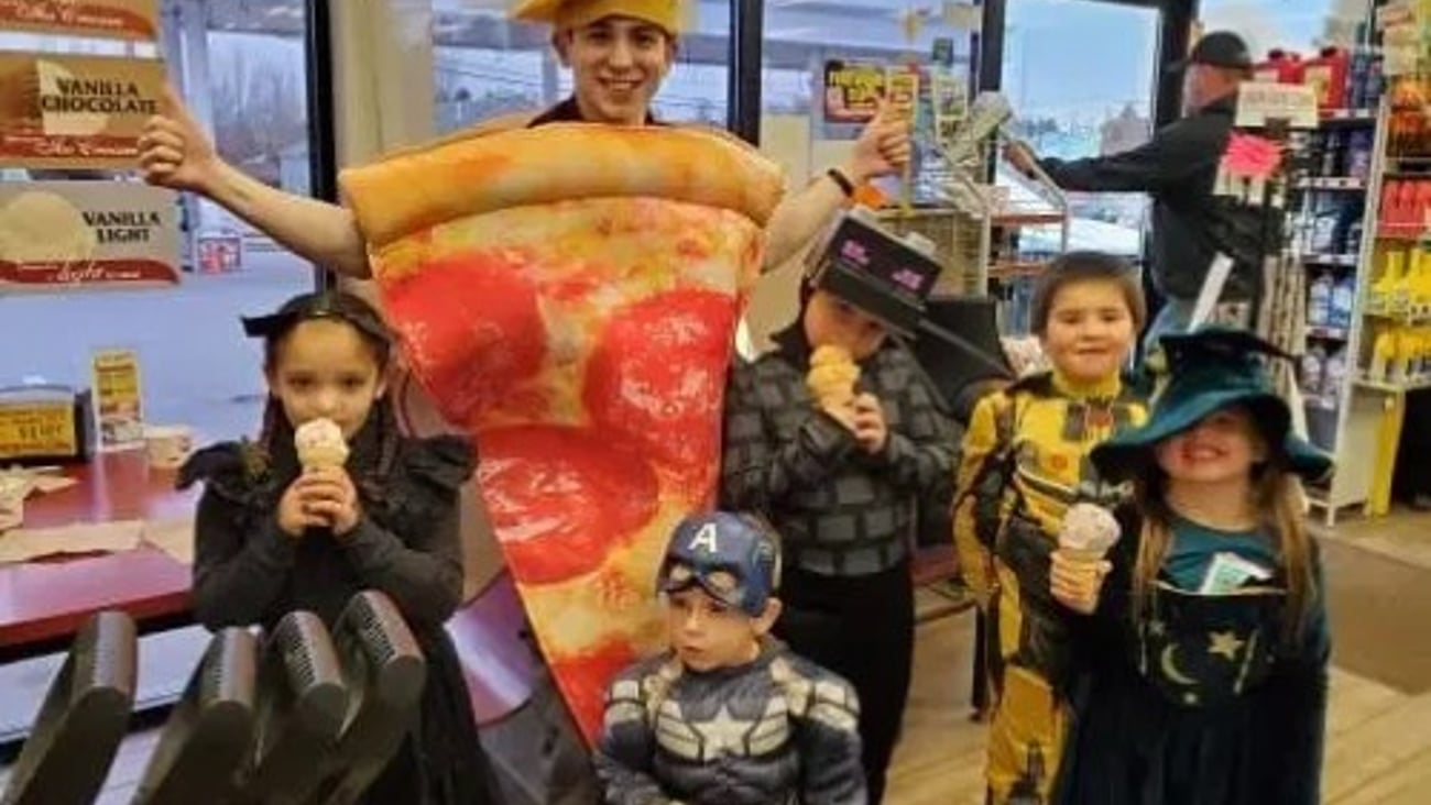 Kids in costume eating ice cream at a Stewart's Shop during Halloween