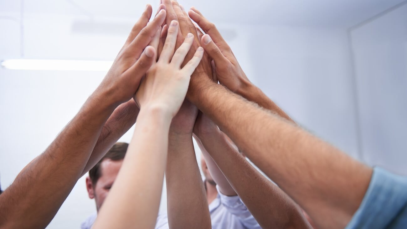 Hands, teamwork and business people high five in office for collaboration, partnership or cooperation. Support, unity and partners with solidarity for motivation, team building or success celebration; Shutterstock ID 2435303675