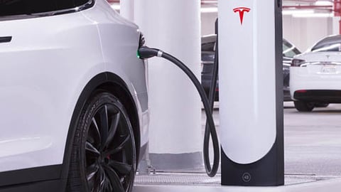 A car parked at a Tesla Supercharging station