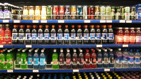 A cooler in a store selling cold drinks