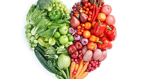 fruits and vegetables make up a food-shaped heart