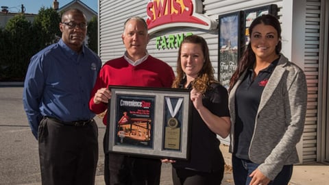 Ken McAllister (left) of Tyson Convenience presents Convenience Store News Foodservice Innovator of the Year award to Swiss Farms President and CEO Scott Simon, Fresh Food Manager Valerie O'Neill, and Brand Manager Caley Smith (far right).