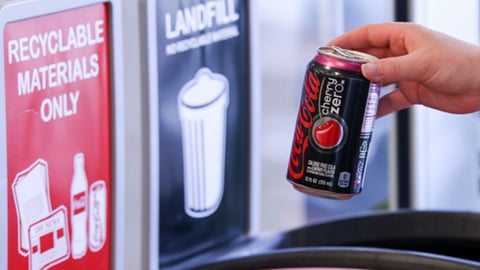 A Coke Zero can being recycled