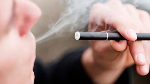 A man using an electronic cigarette