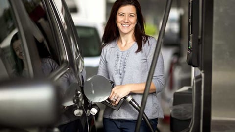 woman pumping gas