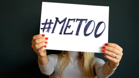 Woman holding #MeToo sign