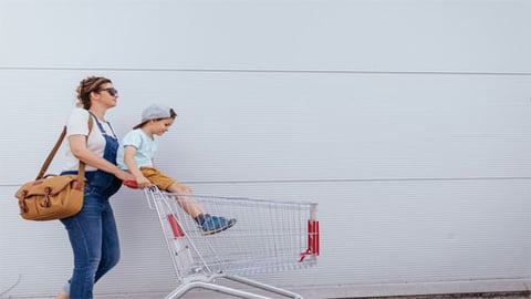 mom pushing shopping cart