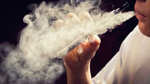 A person using an electronic cigarette