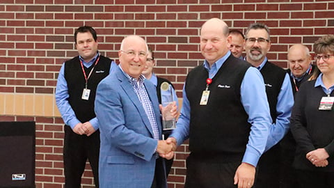 Kwik Trip Foodservice Director Paul Servais (right) accepts the Foodservice Innovator of the Year award from Convenience Store News Editorial Director Don Longo.