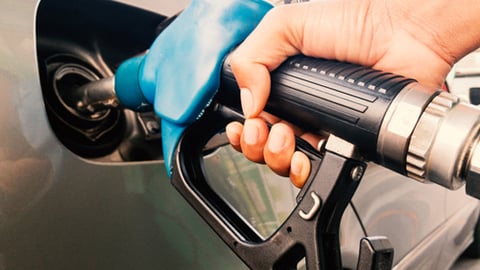 A motorist pumping gas