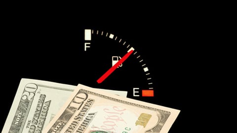 money and a fuel gauge