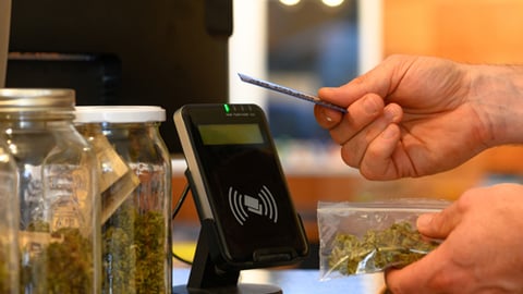 A person buying cannabis at retail