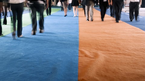 People walking on a trade show floor