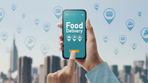 A customer ordering food for delivery through a mobile app