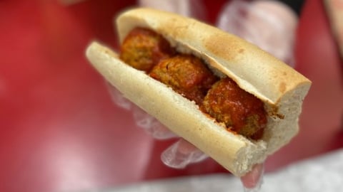 Hand holding a Sheetz Meatball Sub