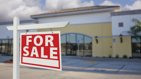 A for sale sign outside a business