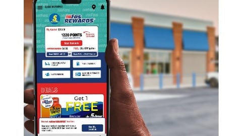 Hand holding phone with fas Rewards app on screen