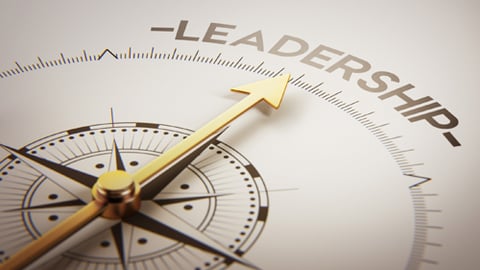 A compass pointing to the word leadership