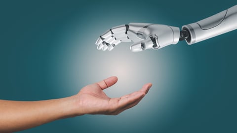 A human hand reaching out to a robot hand