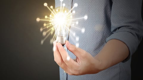 A man holding a lightbulb