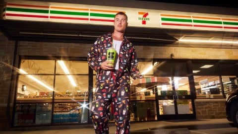 Man in 7-Eleven pajamas with a Slurpee