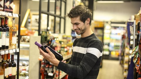 A man buying wine